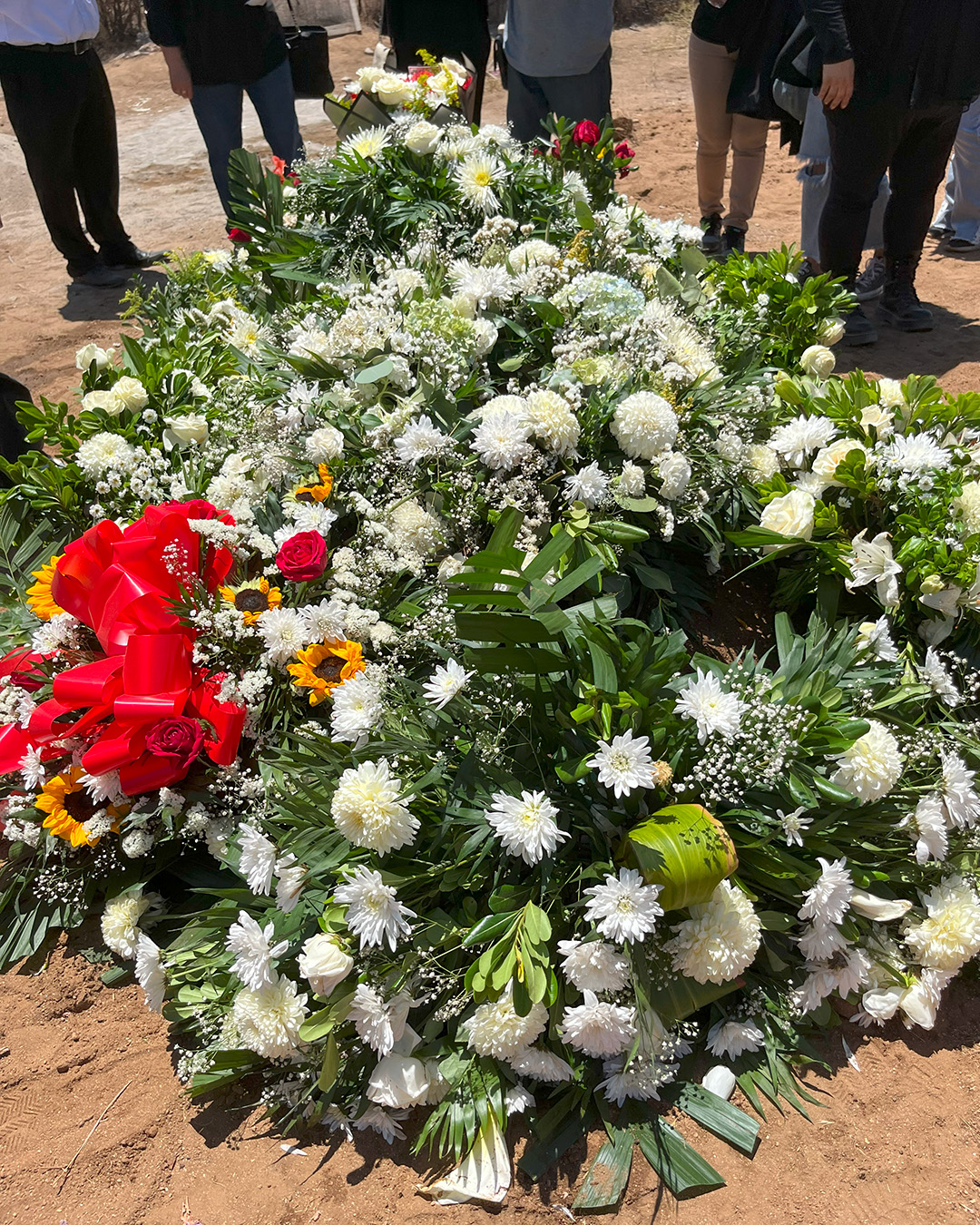 The flowers covering Ramon's resting place