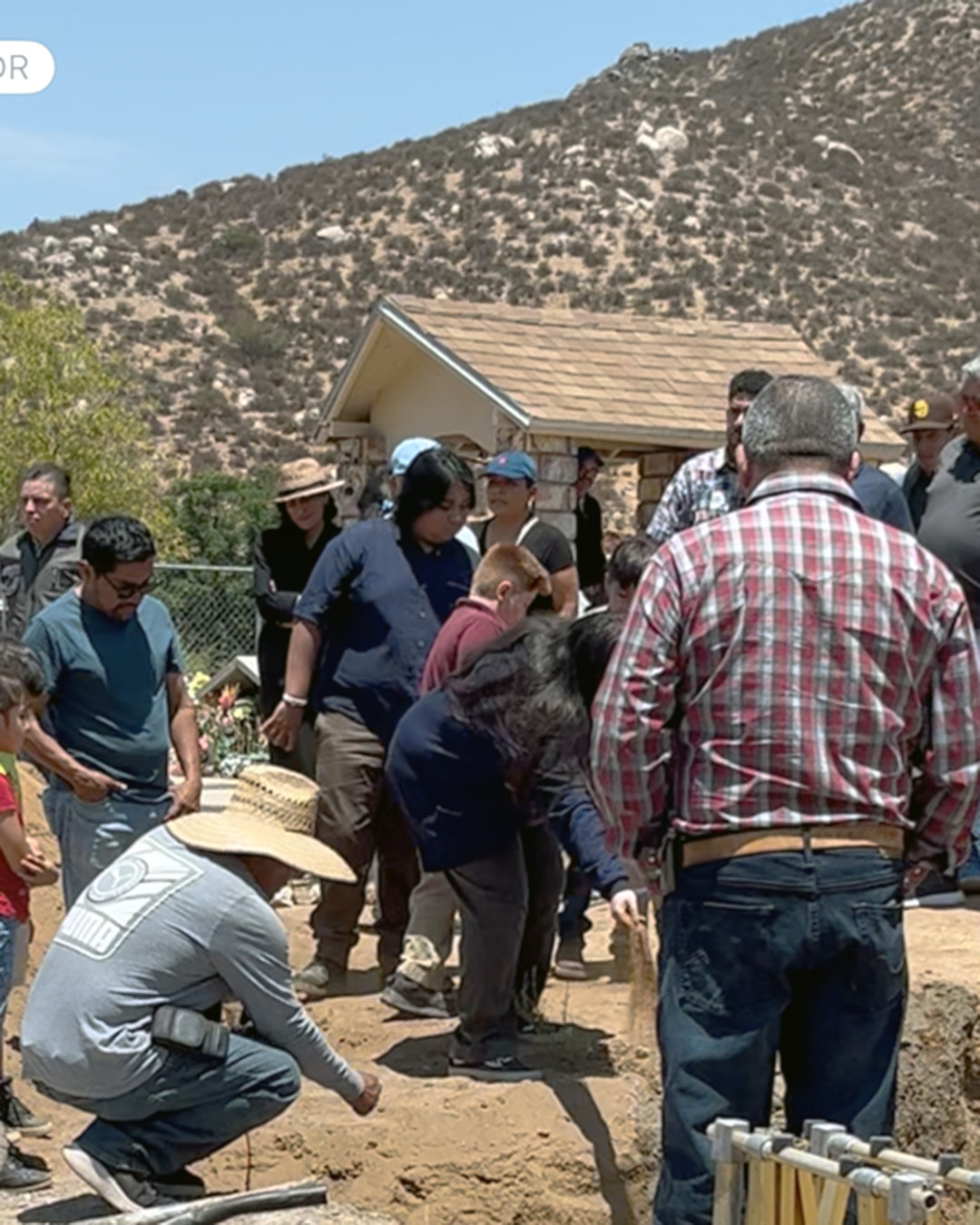 Adding handfuls of dirt as a farewell